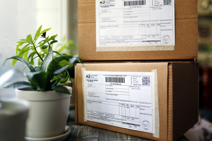Neatly sealed parcels ready for courier delivery